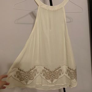 white halter top with embroidered trimming